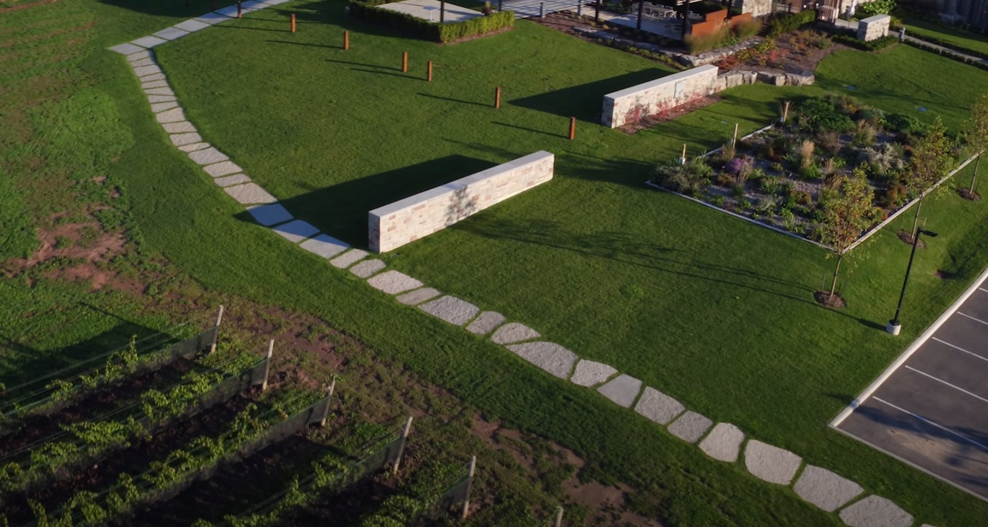 Aerial view of large-scale landscape installation with modern hardscaping elements