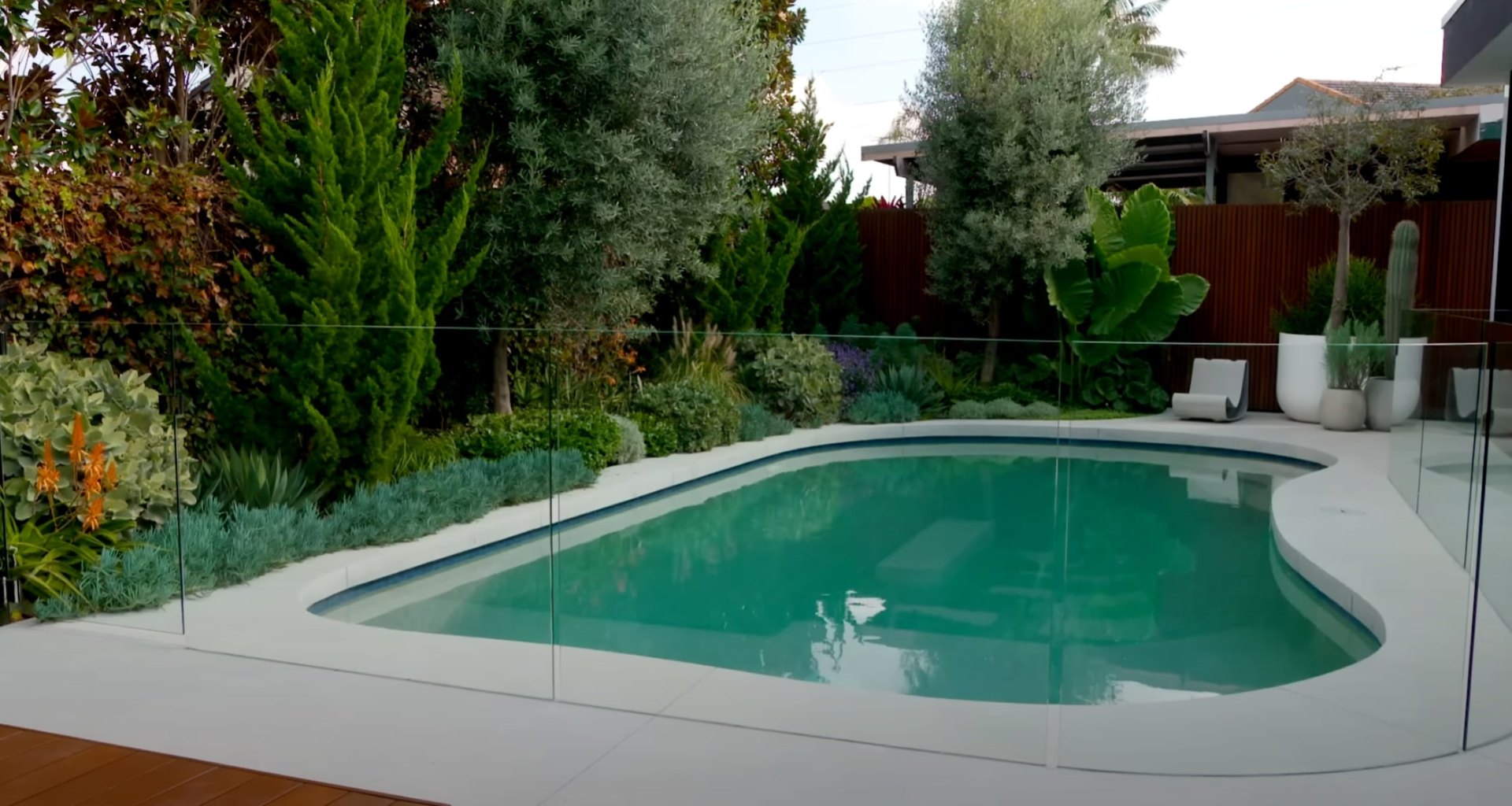 Modern pool area with professional landscaping and contemporary design elements